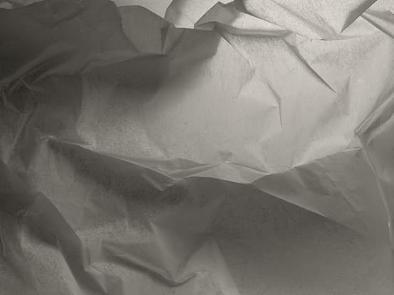 Detailed paper texture representing human oversight